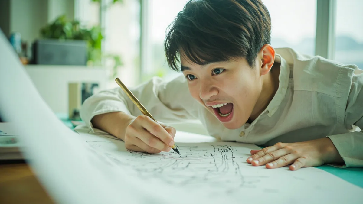 A young person sketches an elaborate, fanciful building design, illustrating “wild impractical ideas” in Chinese: 异想天开 (yì xiǎng tiān kāi)